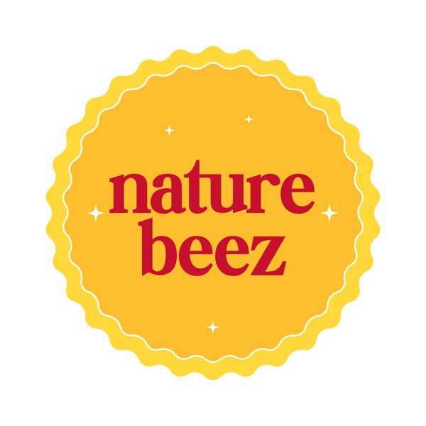 Nature Beez official logo — red text on a yellow circular badge symbolizing purity, joy, and natural baby care.